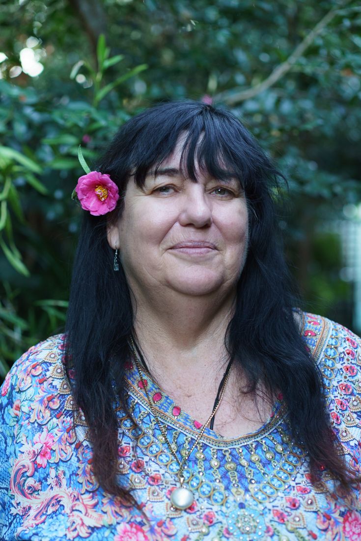 Portrait of Janine with a camellia in her hair